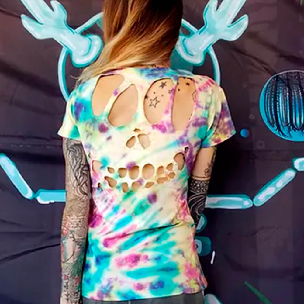 Dua Tua wearing the final Tie-Dye Skull Shirt version, showcasing the back of the shirt.