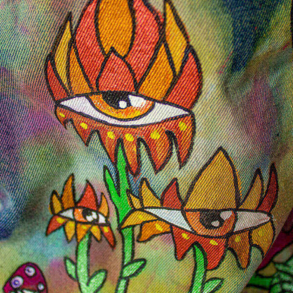 Close-up of the back of the jacket featuring a Cyclop Orange Flower, one of the creatures of Dua Tua's Forest