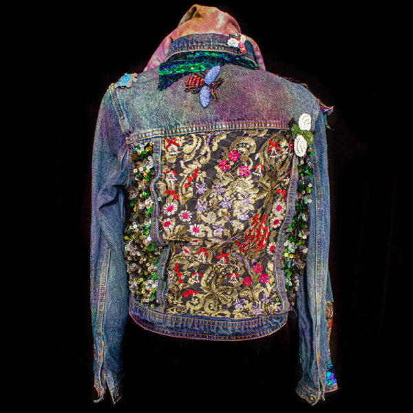 Back view of the Botanica Bugs Jacket, featuring golden lace on the back and decorative insect bead patches.