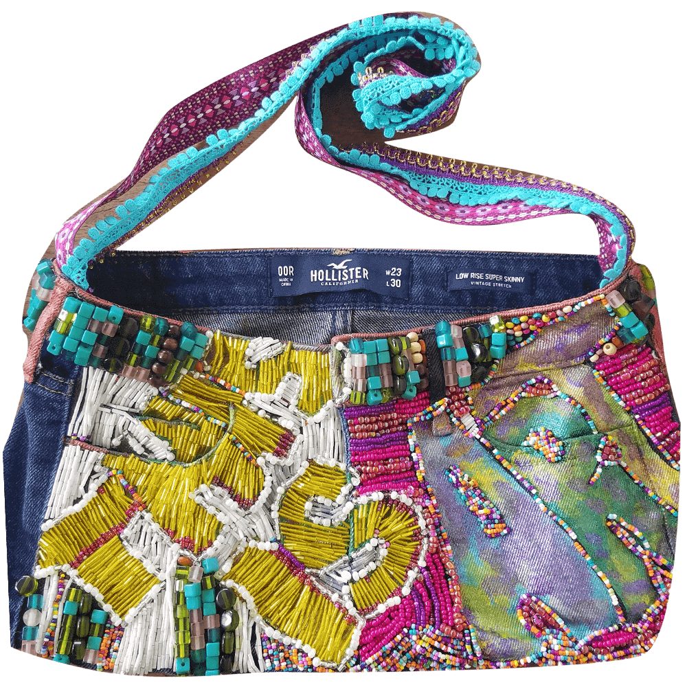 Front view of the "This Is Art Purse," showcasing the beaded texture of the text "This Is Art" with yellow and fuchsia beads.