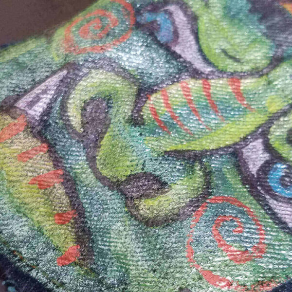 Close-up detail of the green dragon painted on the Dragon Purse.