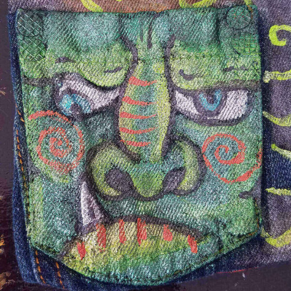 Close-up detail of the green dragon painted on the Dragon Purse.