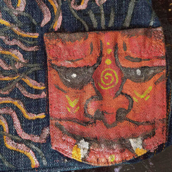 Close-up detail of the red dragon painted on the Dragon Purse.