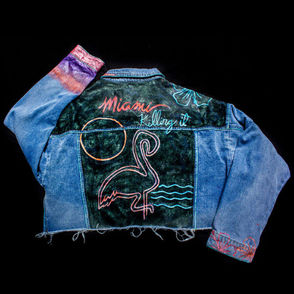 Back view of the "Miami Vice" jacket showcasing a neon-painted flamingo and the message 'Miami Killing it!'