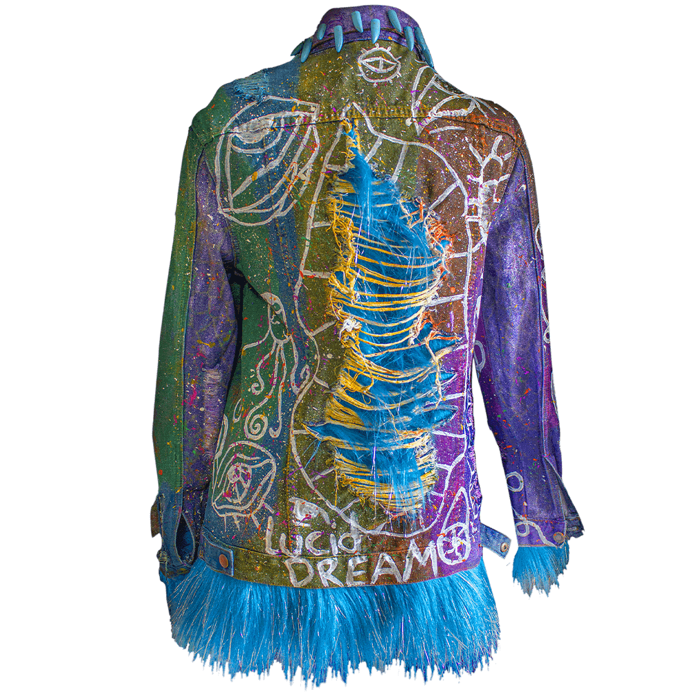 Back view of the Alien denim jacket with a ripped fabric texture, hand-painted white lines, tie-dye effects, colorful paint splatters, and added furry fabric, giving the jacket a unique and textured appearance