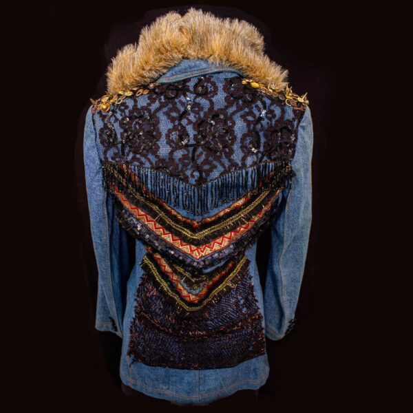 Back view of the She-Fox denim Jacket with elegant black flower lace decoration on the back, complemented by lace trim and accents in red and gold. This is a furry hooded jacket