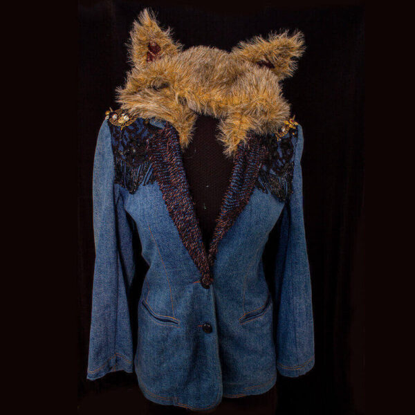 Front view of the She Fox denim furry hooded jacket featuring dark golden and copper long beads on the lapel, shoulder decorations with golden and copper recycled buttons of varying textures and sizes, and a black flower lace texture along the lower edge of the shoulder