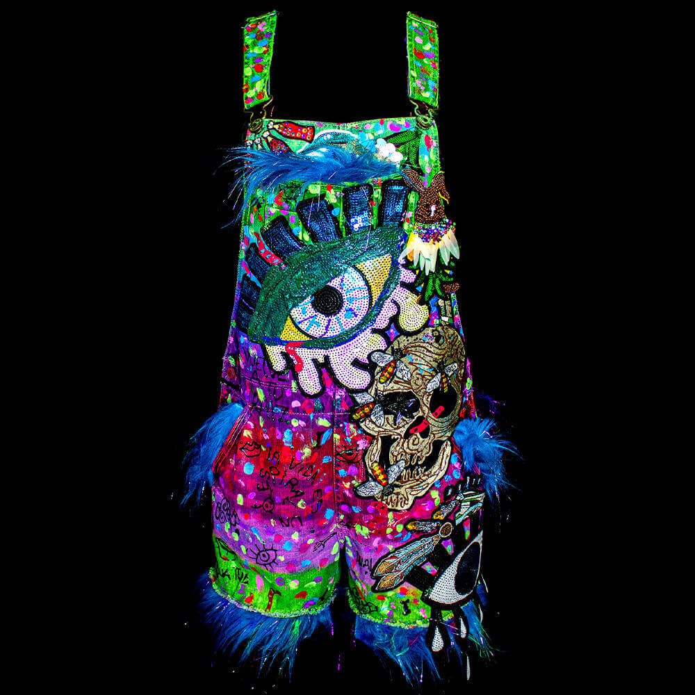 General front view of the Celebrate denim jumpsuit showcases the vivid, multicolored paint - 3D paint draws and decorated giant sequin embroidered patches with fur fabric details inside pockets and short