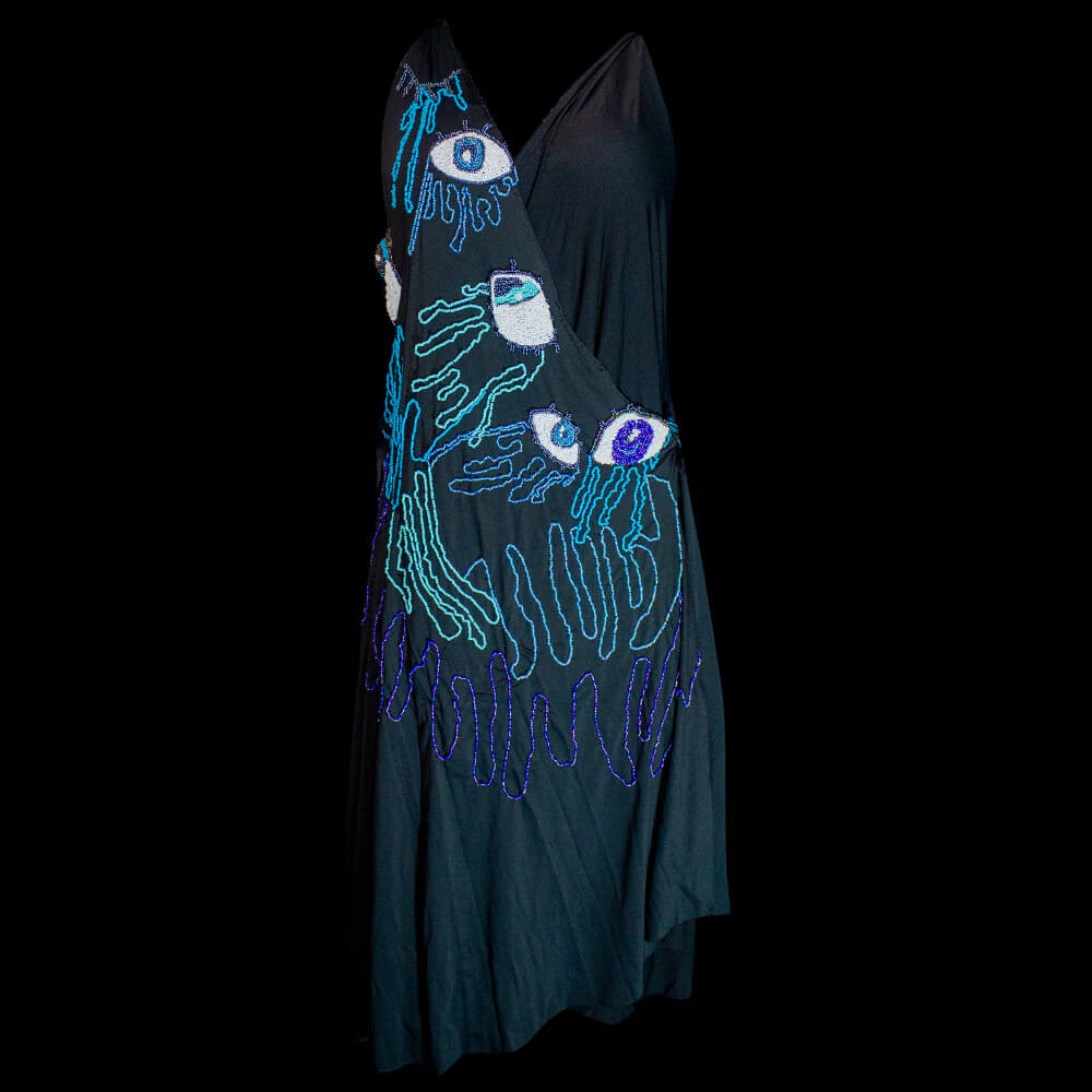 Front view of the two pieces Eye Cry lycra black dress embroidered tears and eyes shapes on the upper and below front with different blue-color beads