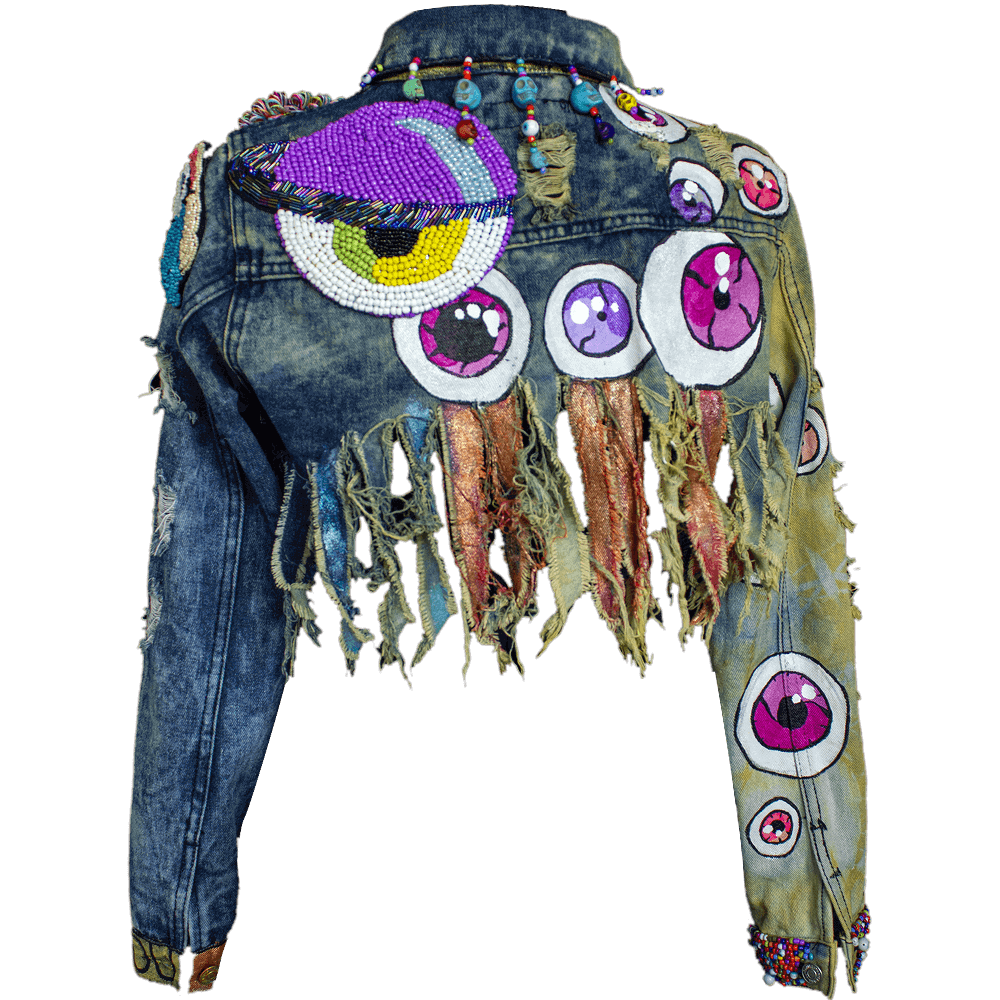 Back view of the Eyes Upcycled Denim Jacket decorated with removable bead eye shape patches in different sizes, details collar embroidered skulls, beads, fabric paint eyes drawings and ripped denim texture on edges