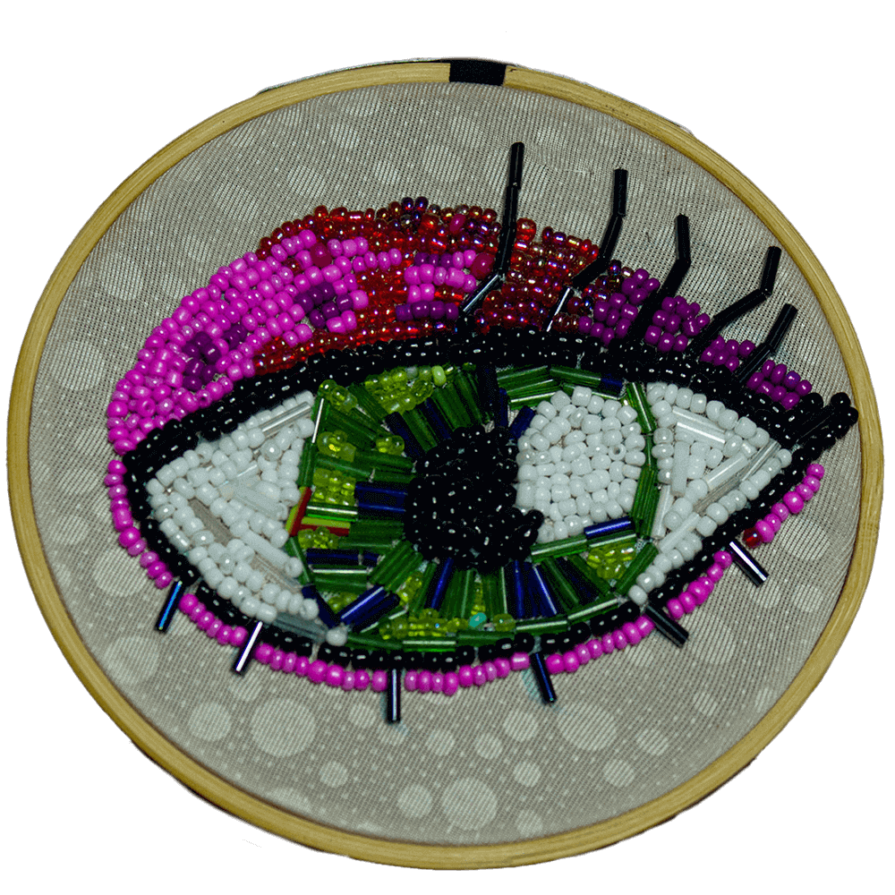 Front view of the Green Eye frame embroidered with vibrant hues of fuchsia, green, and white beads