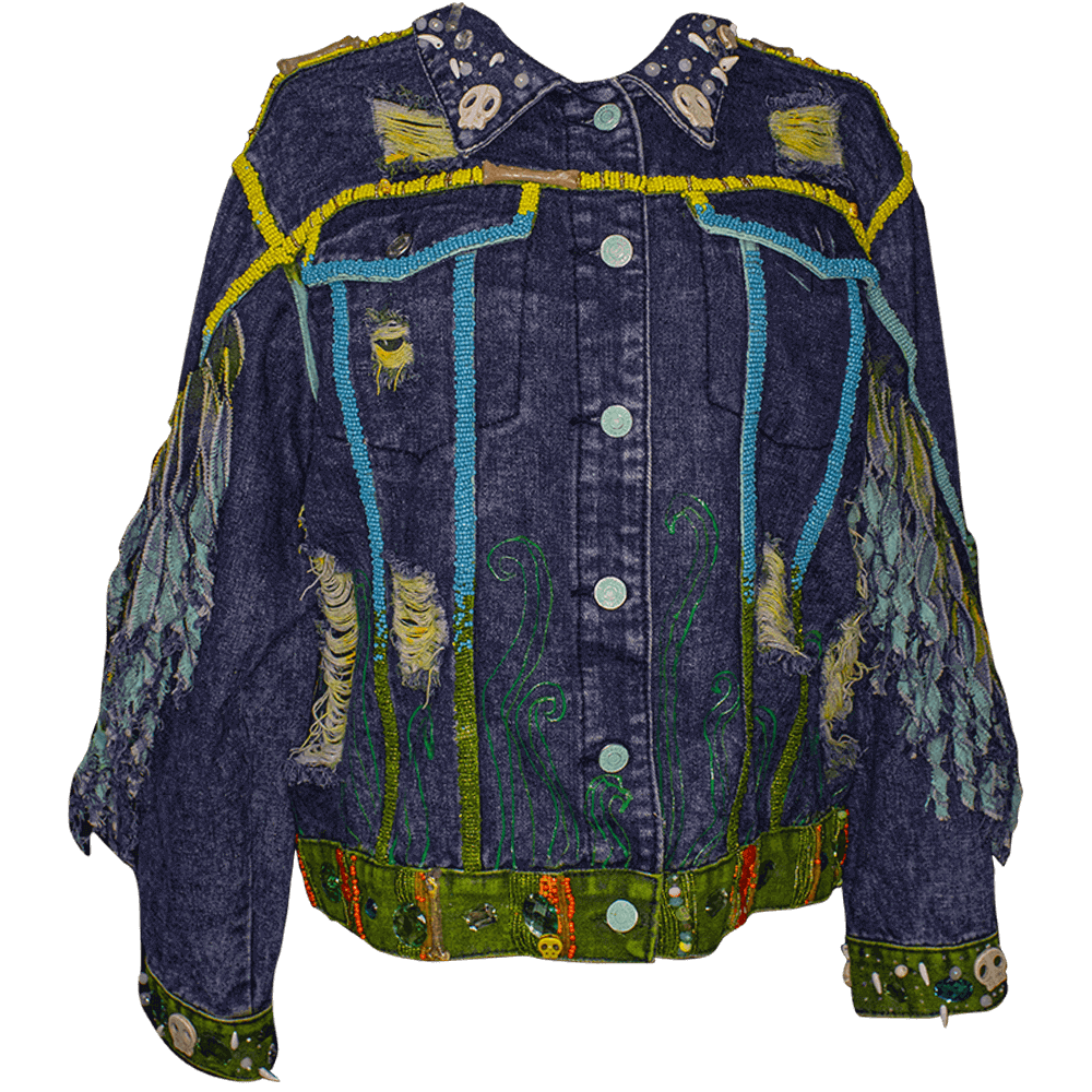 Front view of the Lines-Mango denim jacket with some resin bones accessories, embroidered beads details on the collar and strips, decorated with skulls accessories denim scraps strips, 3D paint and reused buttons, decorative spikes and fabric paint