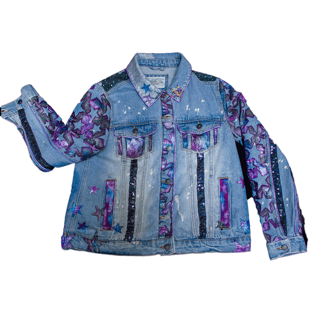 Front general view of the Moon Child denim jacket adorned with metallic fabric paint purple and blue stars, black sequins details and an embroidered beaded star patch on the left side collar