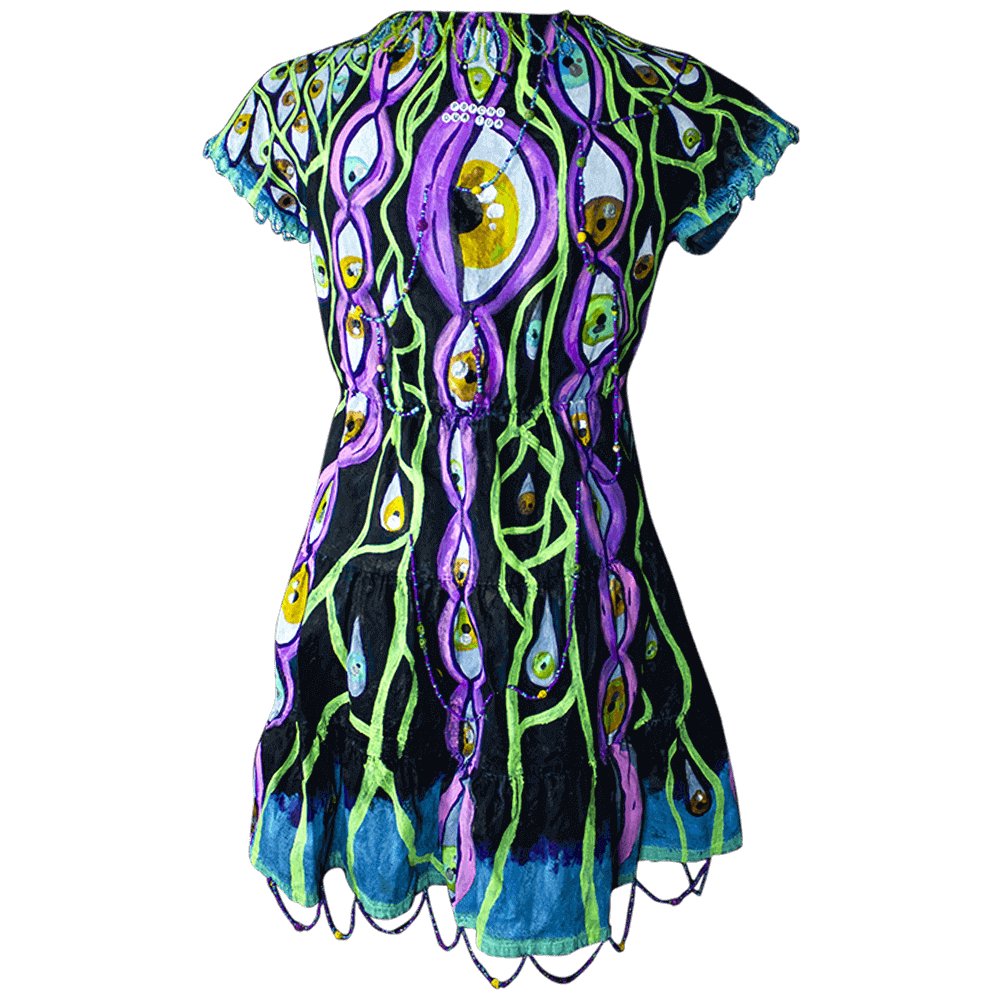 General back view of the Psycho denim dress decorated with fabric paint eyes shapes and lines drawings, embroidered letter beads on the upper back and beads lines on the collar, sleeves and below skirt