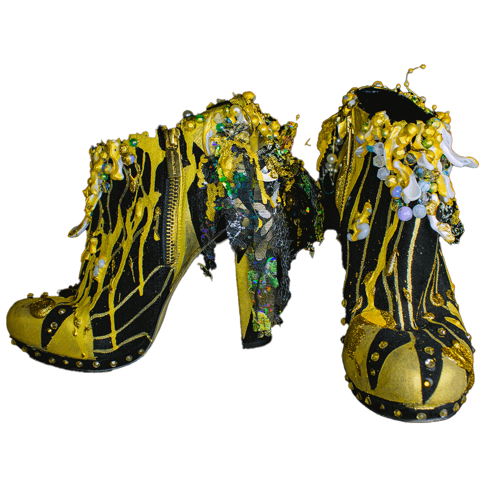 - Front view of the Golden sun heeled booties, featuring golden-black, 3D paint, sequins and laces, decorative accessories and embroidered beads