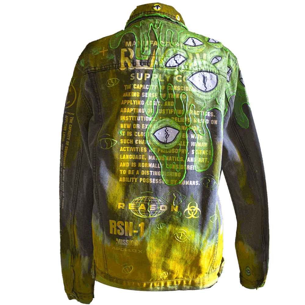 Back view of the Toxic denim jacket decorated with neon green and yellow hues, alien eyes, silk-screened text on the back and 3D paint details