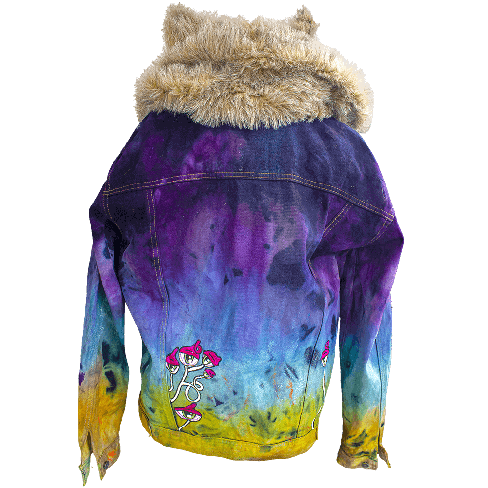 Back view of the Trip hooded denim jacket decorated with synthetic furry fabric for the hood (with ears) a color gradient texture all over the garment and some hand-painted cyclops mushrooms