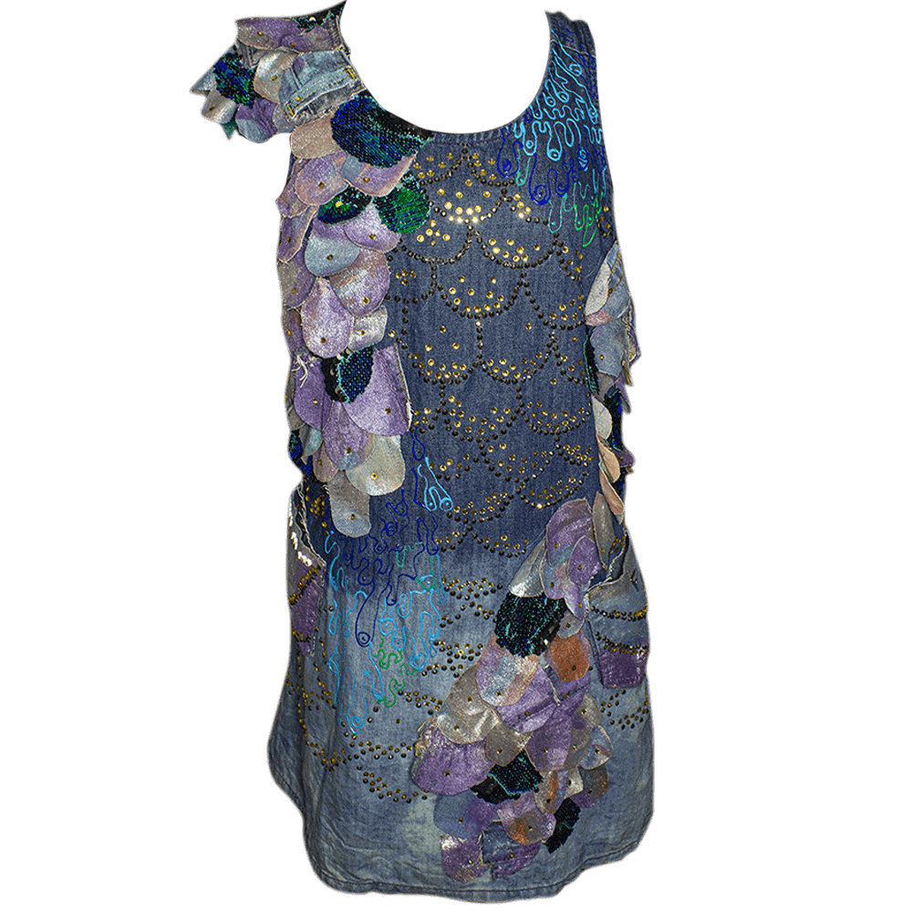 General front view of the of the Escamas denim dress made with scraps of recycled denim and sequins fabric cut into flake shapes decorated with different fabric paint colors and bright fake crystal beads