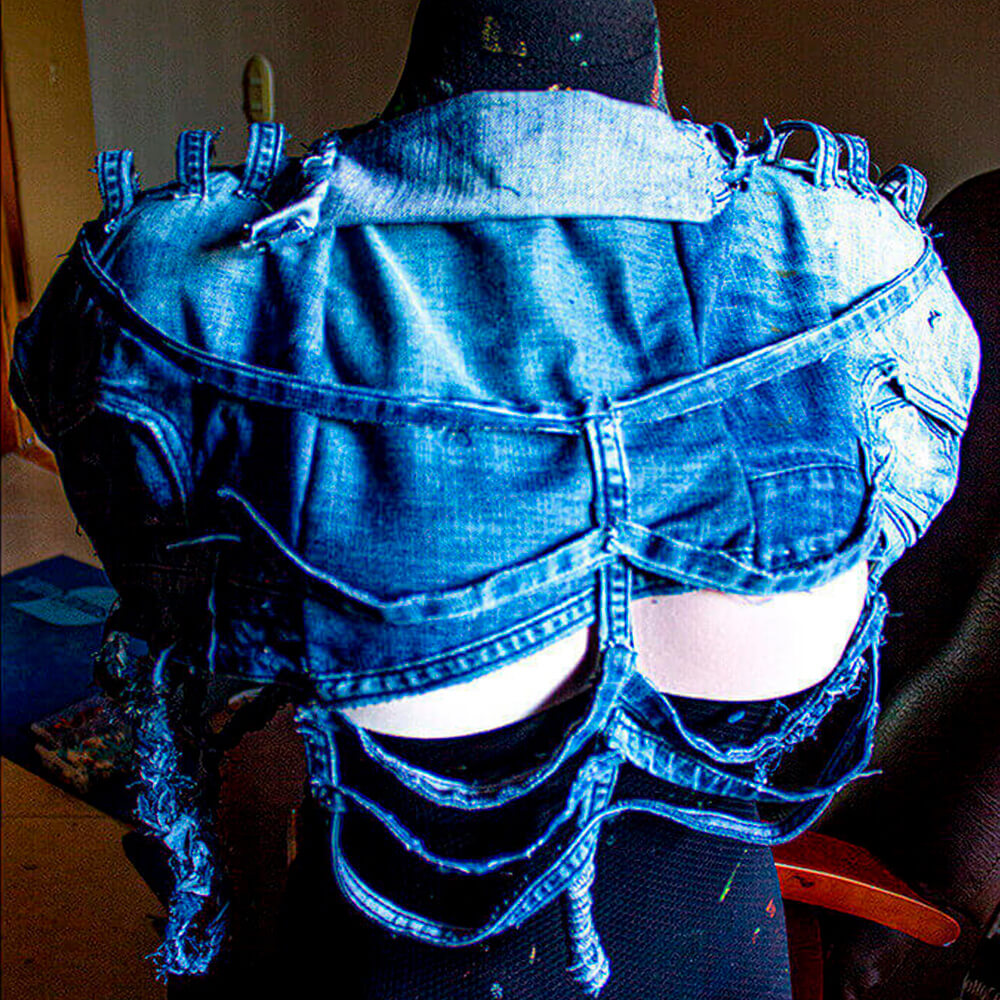 Upcycled Denim Blouse are denim pants transformed into a unique top. Sustainable fashion by Dua Tua