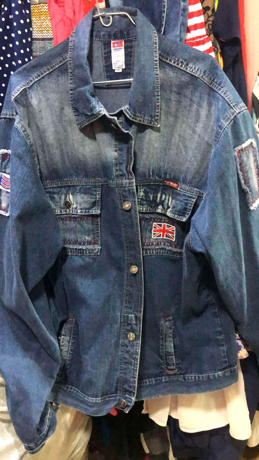 This is the original Tom Papa denim jacket before it underwent its upcycled transformation! Snagged for a steal at just $4 from a thrift store, this jacket was destined for a new life. Check out the next image to see the incredible upcycled creation it became!